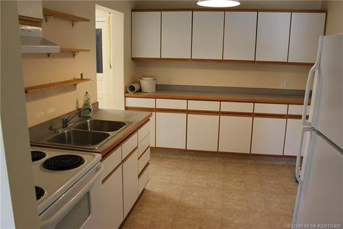 223 Highway Avenue, Picture Butte, AB - Indoor Photo Showing Kitchen With Double Sink