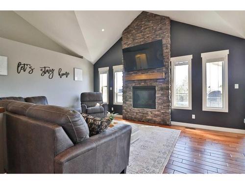 242 6 Street, Stirling, AB - Indoor Photo Showing Living Room With Fireplace