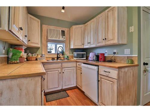 209 4A Street, Stirling, AB - Indoor Photo Showing Kitchen With Double Sink