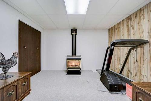 2220 24 Avenue, Coaldale, AB - Indoor With Fireplace