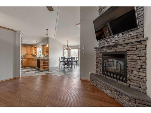 154 Ermineglen Road North, Lethbridge, AB - Indoor Photo Showing Living Room With Fireplace