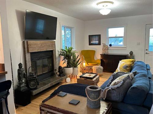 2222 210 Street, Bellevue, AB - Indoor Photo Showing Living Room With Fireplace