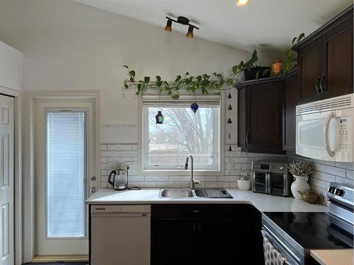 671 Parkside Drive, Coaldale, AB - Indoor Photo Showing Kitchen With Double Sink
