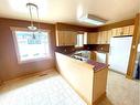 823 Alberta Avenue, Nobleford, AB  - Indoor Photo Showing Kitchen With Double Sink 