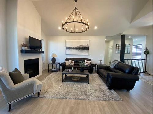 13 Grasslands Road, Rural Taber, M.D. Of, AB - Indoor Photo Showing Living Room With Fireplace