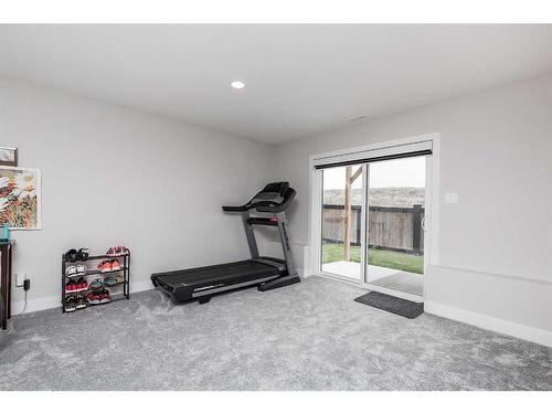 1290 Pacific Circle West, Lethbridge, AB - Indoor Photo Showing Gym Room