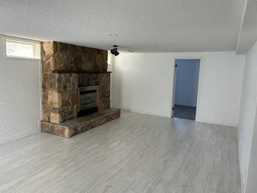 1519 Lakemount Boulevard South, Lethbridge, AB - Indoor Photo Showing Living Room With Fireplace