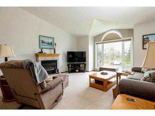23 Ermineview Road North, Lethbridge, AB - Indoor Photo Showing Living Room With Fireplace