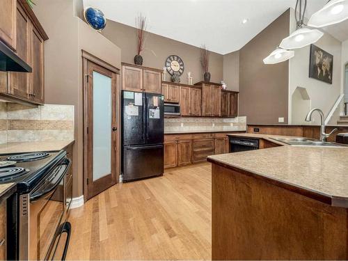 50 Waterfront Landing, Coaldale, AB - Indoor Photo Showing Kitchen With Double Sink