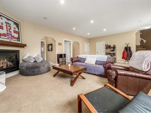 50 Waterfront Landing, Coaldale, AB - Indoor Photo Showing Living Room With Fireplace