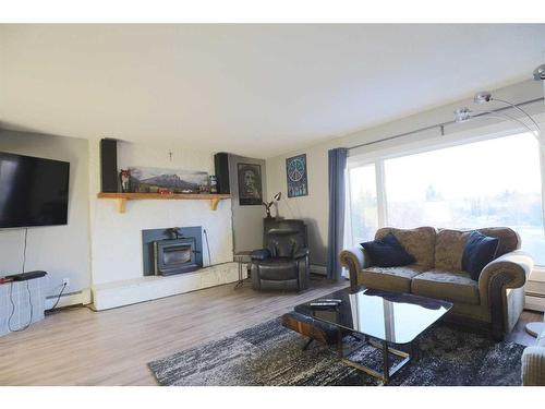 771 Dundas Street, Pincher Creek, AB - Indoor Photo Showing Living Room With Fireplace