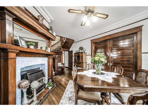 704 Schofield Street, Pincher Creek, AB - Indoor Photo Showing Dining Room With Fireplace