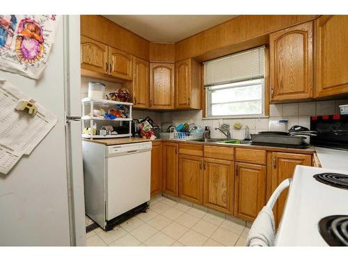 1055 13 Street South, Lethbridge, AB - Indoor Photo Showing Kitchen With Double Sink