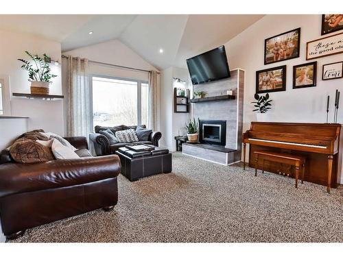 705 10 Avenue West, Barnwell, AB - Indoor Photo Showing Living Room With Fireplace
