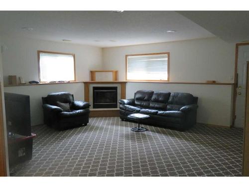 220 Mt. Alderson Crescent West, Lethbridge, AB - Indoor Photo Showing Living Room With Fireplace