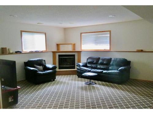 220 Mt. Alderson Crescent West, Lethbridge, AB - Indoor Photo Showing Living Room With Fireplace