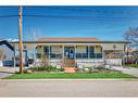 338 4A Street, Stirling, AB  - Outdoor With Deck Patio Veranda With Facade 