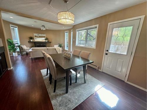 14 Kings Road South, Lethbridge, AB - Indoor Photo Showing Dining Room With Fireplace