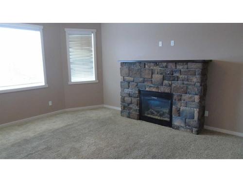 653 19 Street, Fort Macleod, AB - Indoor Photo Showing Living Room With Fireplace