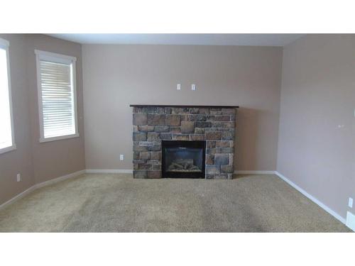 653 19 Street, Fort Macleod, AB - Indoor Photo Showing Living Room With Fireplace