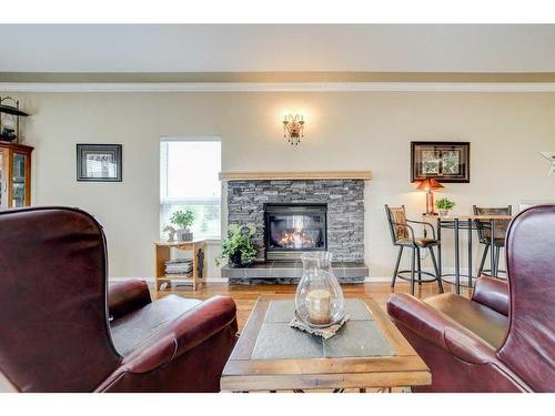720 Minto Street, Granum, AB - Indoor Photo Showing Living Room With Fireplace