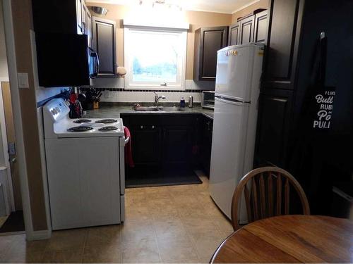 709 7 Street North, Lethbridge, AB - Indoor Photo Showing Kitchen With Double Sink