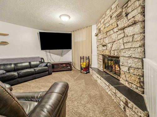 169 Lakhota Crescent West, Lethbridge, AB - Indoor Photo Showing Living Room With Fireplace