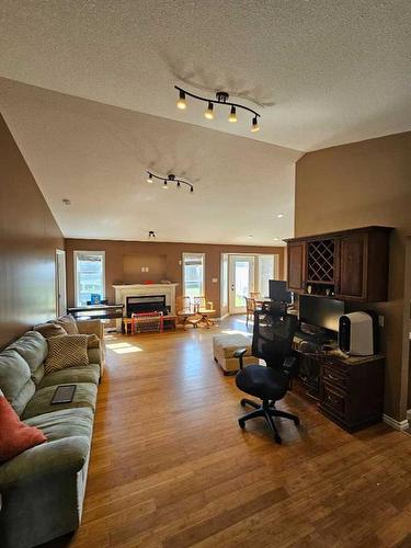 2124 25 Street, Coaldale, AB - Indoor Photo Showing Living Room With Fireplace
