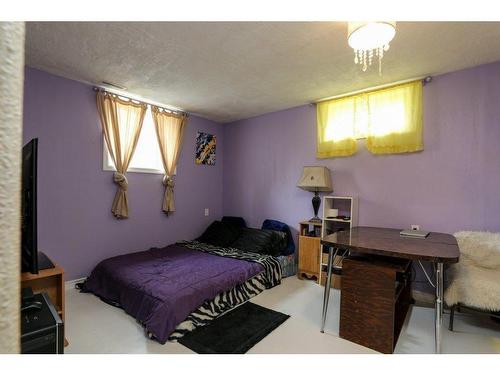 323 Whitney Street, Carmangay, AB - Indoor Photo Showing Bedroom