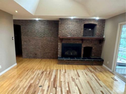 527 Centennial Avenue, Picture Butte, AB - Indoor Photo Showing Other Room With Fireplace