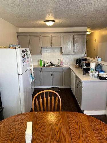151 1 Street East, Cardston, AB - Indoor Photo Showing Kitchen With Double Sink