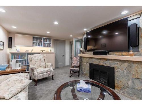 2825 Parkside Drive South, Lethbridge, AB - Indoor Photo Showing Living Room With Fireplace