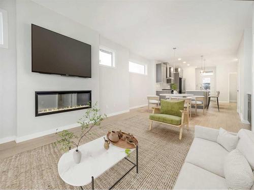 4602 26 Avenue South, Lethbridge, AB - Indoor Photo Showing Living Room With Fireplace