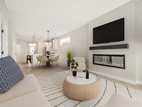 4606 26 Avenue South, Lethbridge, AB - Indoor Photo Showing Living Room With Fireplace