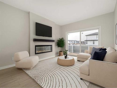 4606 26 Avenue South, Lethbridge, AB - Indoor Photo Showing Living Room With Fireplace