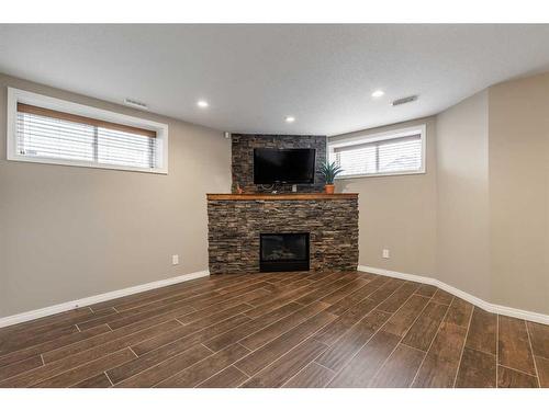 150 Southgate Boulevard South, Lethbridge, AB - Indoor Photo Showing Basement With Fireplace