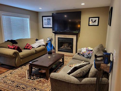 33 Laurel Place, Coalhurst, AB - Indoor Photo Showing Living Room With Fireplace
