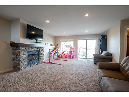 255 Canyon Estates Way West, Lethbridge, AB - Indoor Photo Showing Living Room With Fireplace