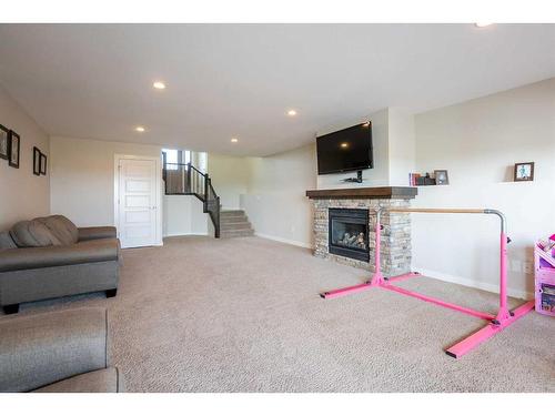 255 Canyon Estates Way West, Lethbridge, AB - Indoor Photo Showing Living Room With Fireplace