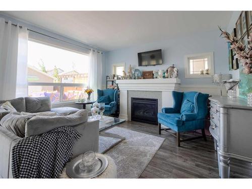 55 Riverhurst Cove West, Lethbridge, AB - Indoor Photo Showing Living Room With Fireplace