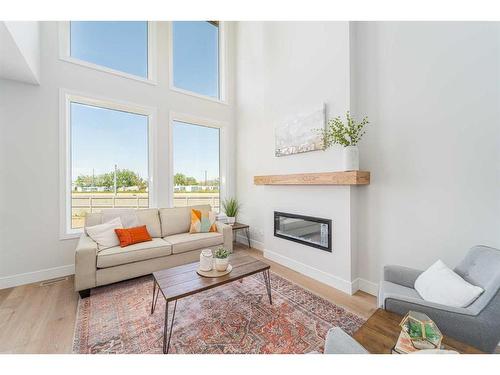 4505 25 Avenue South, Lethbridge, AB - Indoor Photo Showing Living Room With Fireplace