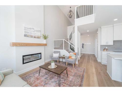 4505 25 Avenue South, Lethbridge, AB - Indoor Photo Showing Living Room With Fireplace