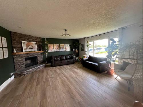 224 8 Street West, Cardston, AB - Indoor Photo Showing Living Room With Fireplace