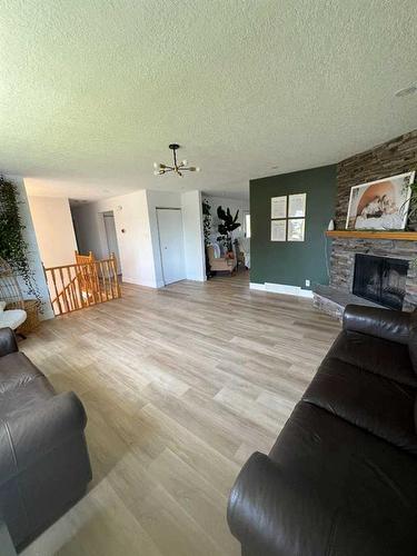 224 8 Street West, Cardston, AB - Indoor Photo Showing Living Room With Fireplace