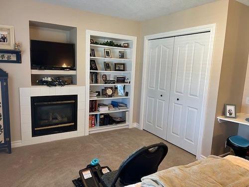 422 West Creek Drive, Cardston, AB - Indoor With Fireplace