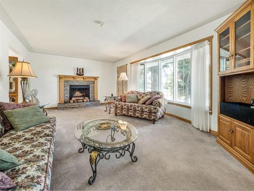 1601 Lakeshore Road South, Lethbridge, AB - Indoor Photo Showing Living Room With Fireplace