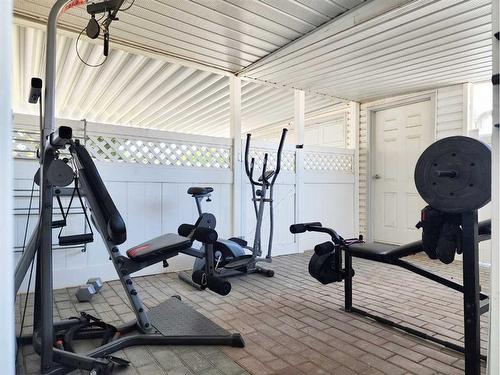 4413 3Rd Street West, Claresholm, AB - Indoor Photo Showing Gym Room