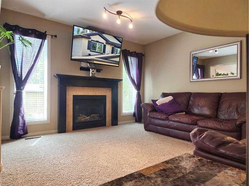 1592 Coalbanks Boulevard West, Lethbridge, AB - Indoor Photo Showing Living Room With Fireplace