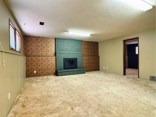 21 Lafayette Crescent West, Lethbridge, AB - Indoor With Fireplace