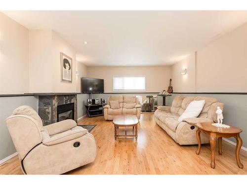 30 Heritage Crescent West, Lethbridge, AB - Indoor Photo Showing Living Room With Fireplace